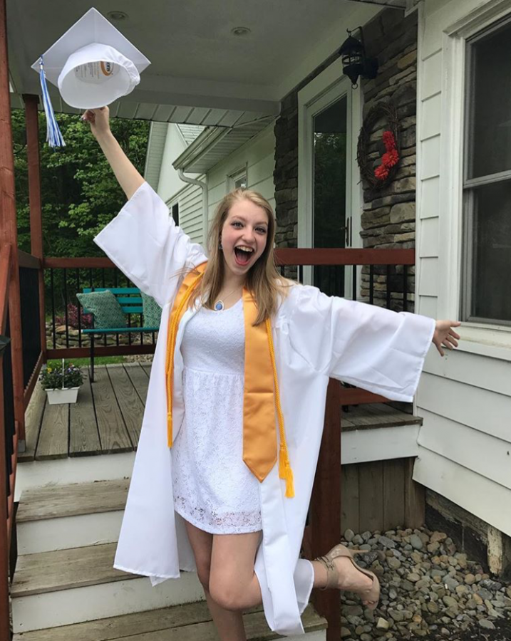 Meg is happy to be done with high school! 